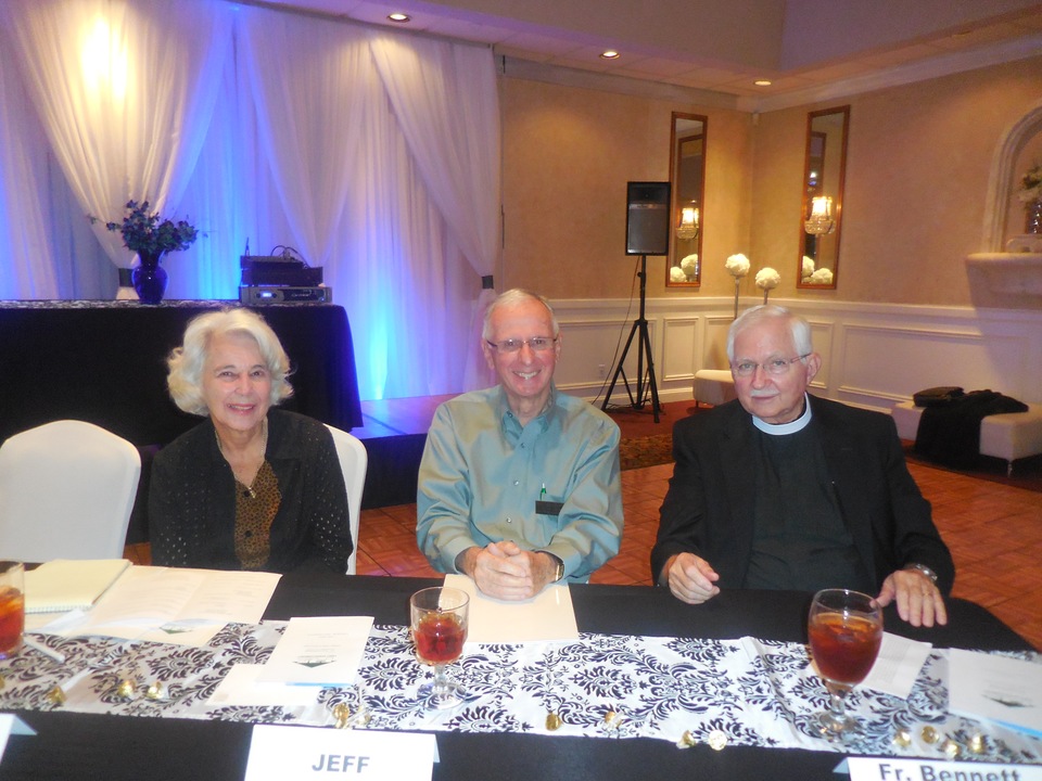 Former Secretary Patti Ann Walsh (sitting in for Secretary Peggy Walsh), Treasurer Jeff Day and Father Ernie Bennett of St. James Episcopal Church,who gave the invocation, at the head table.